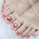 Toes with red and white floral nail design wearing sheer socks, Obroi