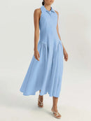 A woman modeling a sleeveless light blue midi dress with a collared neckline and a flared skirt, shown against a plain light background. The brand name 'Obroi' is visible in the top-left corner.