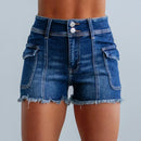Blue denim shorts with white buttons on a gray background
