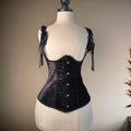 Black corset on a mannequin against a neutral background, Obroi