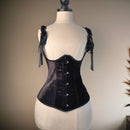 Black corset on a mannequin against a neutral background, Obroi
