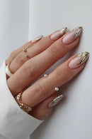 Hand with pink and gold nail art on a white background, Obroi