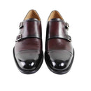 Pair of brown leather shoes with buckles on a white background, Obroi