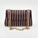 Purple handbag with gold chain strap on a white background
