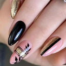 Close-up of a hand with black, pink, and gold nail design, Obroi
