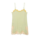 A pale sage green camisole nightgown with yellow floral lace trim at the neckline and hem, displayed against a solid white background, Obroi