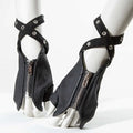 Black fingerless gloves with ankle straps and silver metal grommets, displayed on white mannequin feet against a white background, Obroi