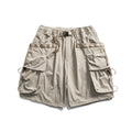 Beige cargo shorts with multiple pockets on a white background, Obroi