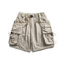 Beige cargo shorts with multiple pockets on a white background, Obroi