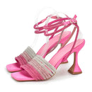 Pink high-heeled sandals with clear straps on a white background, Obroi