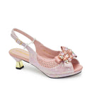 Pink high-heeled shoe with decorative flower and embellishments on a white background, Obroi