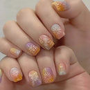 Nails with a gradient design featuring orange, pink, and white colors on a neutral background, Obroi