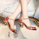 Obroi Red and gold embroidered high-heeled shoes on a light background