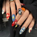 Close-up of hands with intricately designed nails featuring various patterns and colors, Obroi