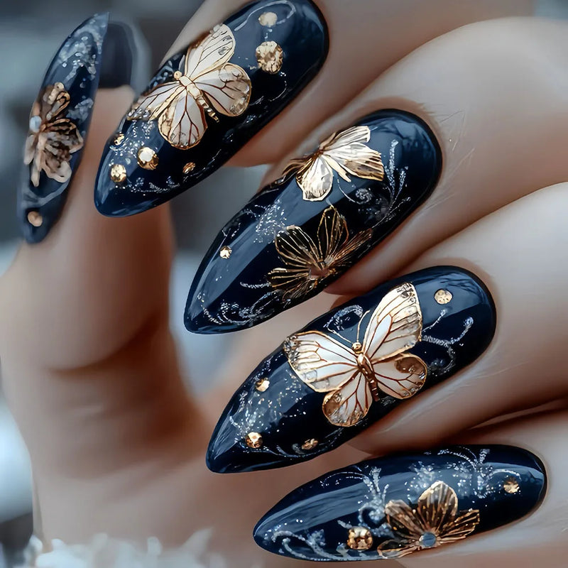 Nails with black and gold butterfly design, Obroi
