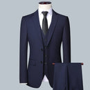 Obroi Navy blue suit with a tie on a mannequin against a light gray background