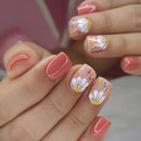 Nails with floral design and pink polish on a blurred background, Obroi