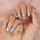 Hand with silver glittery nail polish on a pink background ,Obroi