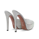 Silver high-heeled shoes with rhinestone embellishments on a white background, Obroi