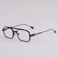 Black eyeglasses on a light gray background, Obroi