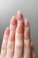 Hand with pink nail polish on a gray background, Obroi