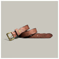 Brown leather belt with brass buckle on a light gray background, Obroi
