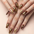Nails with gold leaf design on a beige background, Obroi