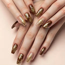 Nails with gold leaf design on a beige background, Obroi