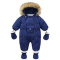 Blue baby snowsuit with fur hood on a white background