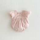 Pink baby romper with ruffled sleeves on a light gray background, Obroi