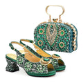 Green embellished shoes and matching handbag on a white background, Obroi