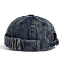 Denim cap with distressed details on a white background, Obroi