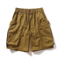 Brown shorts with drawstring on a white background, branded 'Obroi'.
