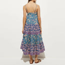 Woman wearing a blue and pink floral dress on a white background, Obroi