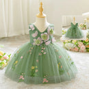 Green floral dress on a mannequin with a soft background, Obroi