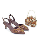 Obroi Pair of brown shoes with gold embellishments and a matching handbag on a white background.