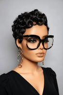 Two identical mannequin heads with black glasses and earrings on a gray background, Obroi