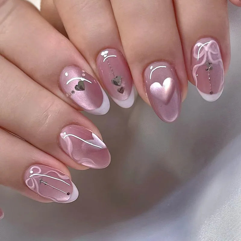 Close-up of a hand with pink nail art on a neutral background, Obroi