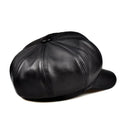Black leather cap on a white background, Obroi