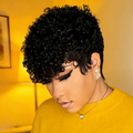 Woman with styled hair wearing a yellow sweater in a warm-toned room, Obroi