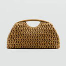 Woven handbag on a light gray background, Obroi