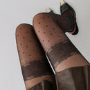 Obroi Brown patterned tights worn by a person on a light gray background