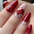 Nails with red and pink design featuring roses and hearts on a light background, Obroi