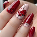 Nails with red and pink design featuring roses and hearts on a light background, Obroi