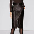 Black leather skirt with zippers worn by a person on a light gray background ,Obroi