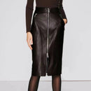 Black leather skirt with zippers worn by a person on a light gray background ,Obroi
