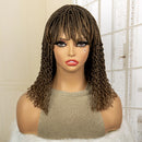 Mannequin head with a brown braided wig on a neutral background, Obroi