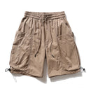Beige shorts with drawstring on a white background, featuring the brand 'Obroi'.