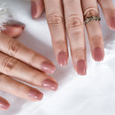 Close-up of hands with pink nail polish on a white background, Obroi
