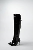 Black patent knee-high boots on a white background, Obroi